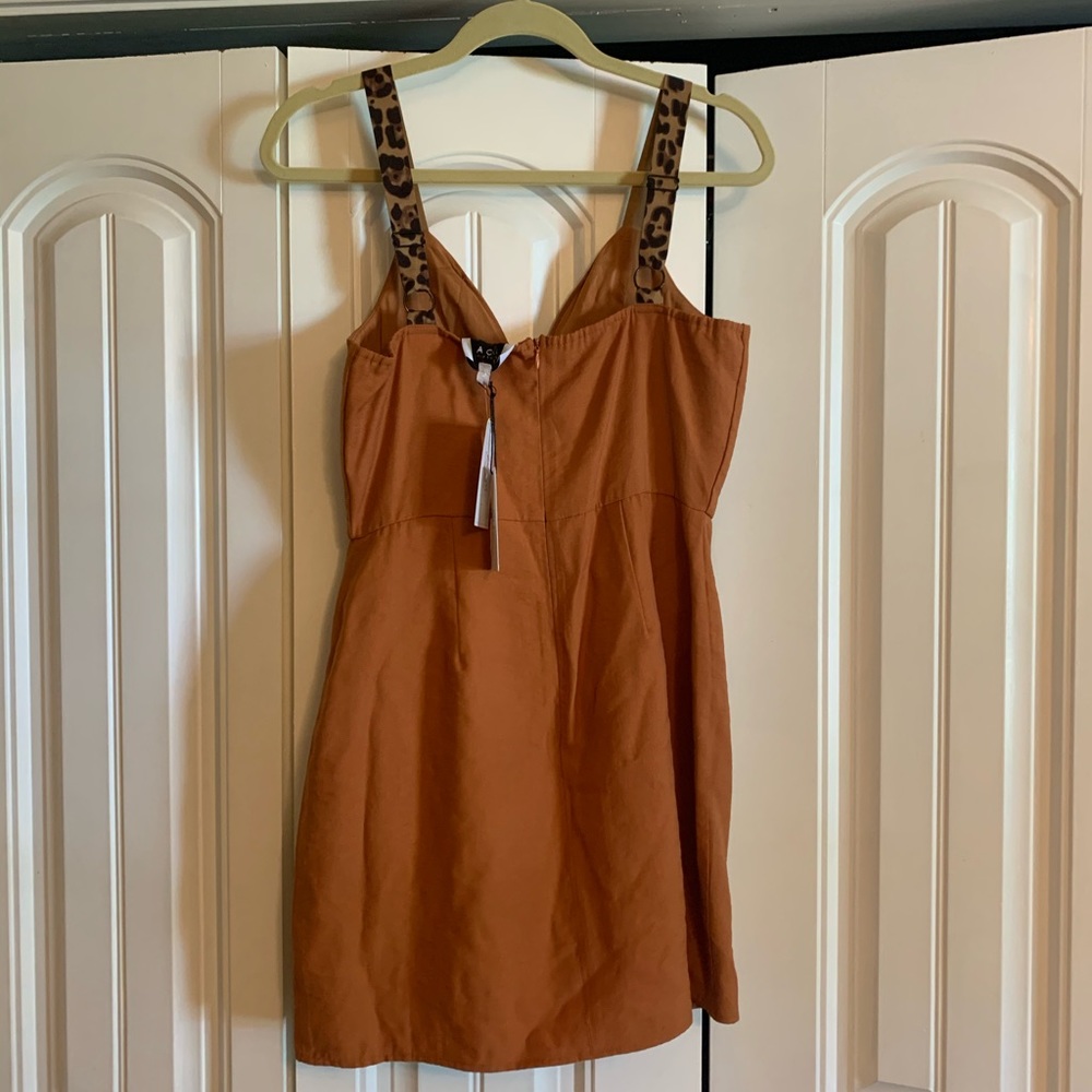 Size medium dress with leopard straps, never worn!